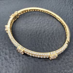 Akkad Rhinestone Gold Tone Hinged Bangle 2.5" Oval Signed